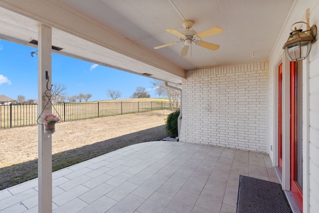 view of patio featuring a fenced backyard and ceiling fan