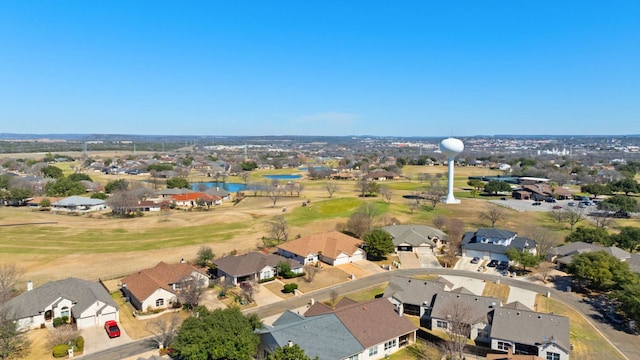 bird's eye view featuring a residential view and a water view