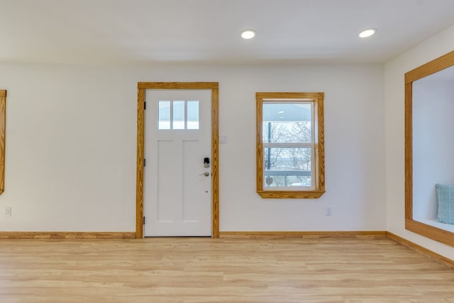 entryway with recessed lighting, baseboards, and light wood-type flooring