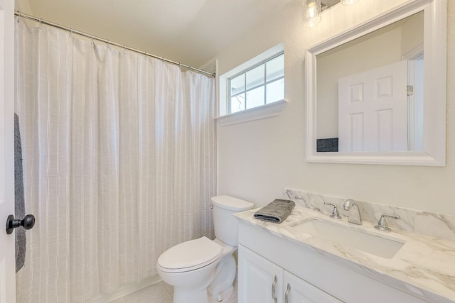 bathroom with tile patterned floors, toilet, and vanity