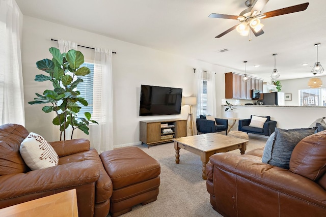 102 Tokalaun Dr, Hutto, TX 78634 - living room with a ceiling fan and light carpet