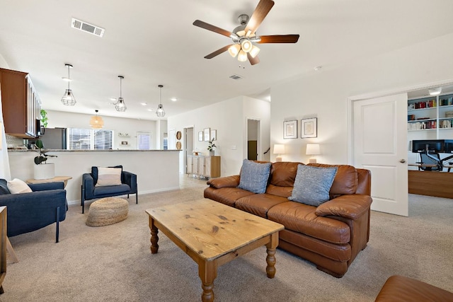 102 Tokalaun Dr, Hutto, TX 78634 - living room with light carpet and a ceiling fan