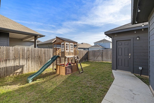 102 Tokalaun Dr, Hutto, TX 78634 - fenced backyard featuring a playground