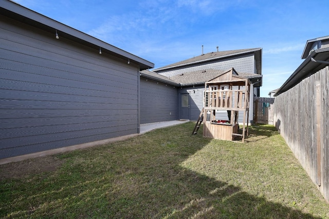 102 Tokalaun Dr, Hutto, TX 78634 - rear view of house featuring a playground