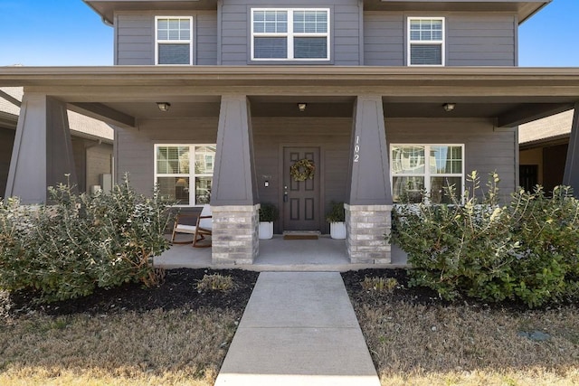 102 Tokalaun Dr, Hutto, TX 78634 - doorway to property featuring covered porch