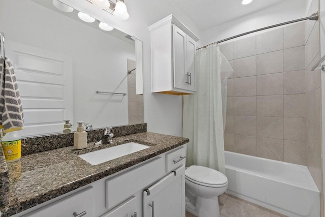 bathroom featuring tile patterned floors, vanity, toilet, and shower / tub combo