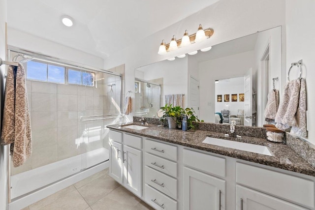 full bathroom with tile patterned floors, a stall shower, ensuite bath, and a sink