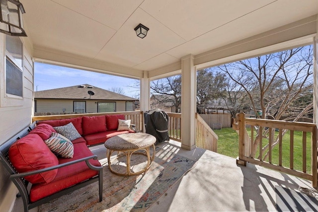 view of patio featuring an outdoor living space, area for grilling, a deck, and fence