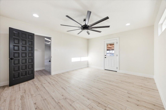 unfurnished room with a ceiling fan, recessed lighting, wood finished floors, and baseboards