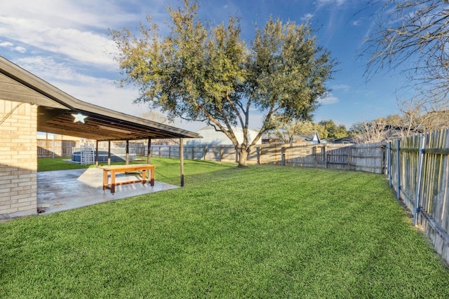 view of yard featuring a patio area and a fenced backyard