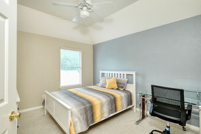 bedroom with baseboards, lofted ceiling, a ceiling fan, and carpet flooring