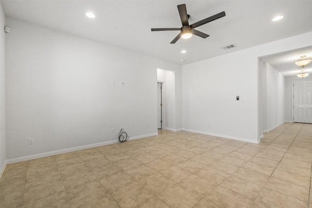 unfurnished room featuring visible vents, recessed lighting, and baseboards