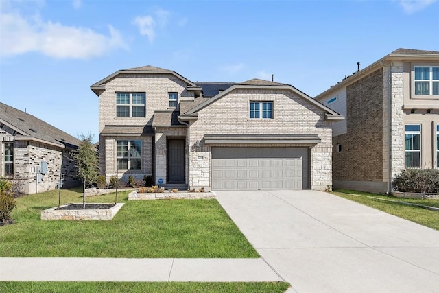 view of front of property featuring a front yard, concrete driveway, a garage, brick siding, and roof mounted solar panels