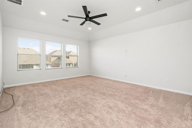 unfurnished room with recessed lighting, visible vents, carpet floors, and baseboards