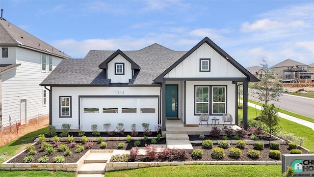 view of front of house with board and batten siding, a porch, an attached garage, and a shingled roof