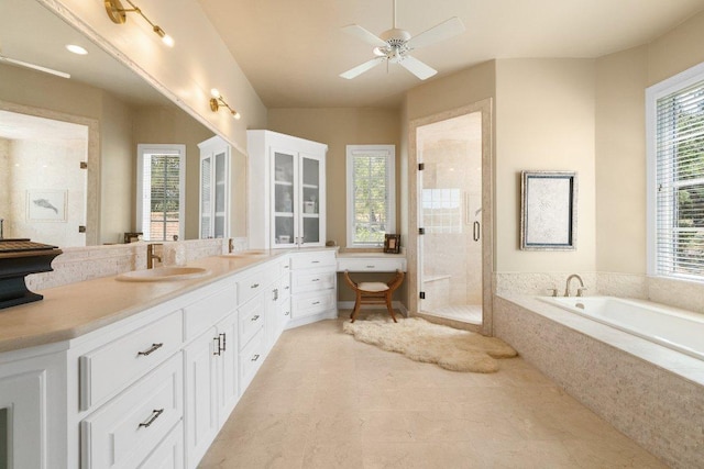 full bath with a ceiling fan, a shower stall, a bath, and vanity