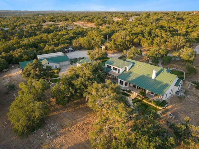 drone / aerial view featuring a view of trees