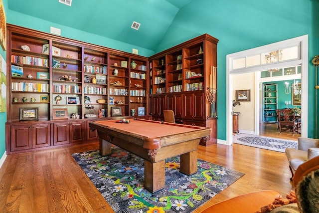 recreation room with visible vents, pool table, lofted ceiling, and wood finished floors