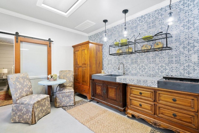 interior space with a barn door, visible vents, ornamental molding, and wallpapered walls