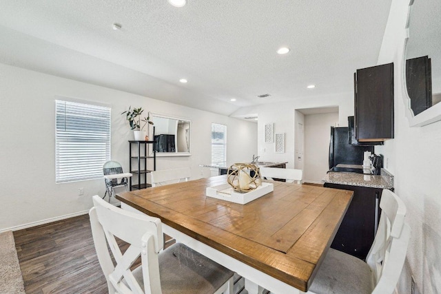 dining room featuring recessed lighting, dark wood-style floors, baseboards, and a textured ceiling