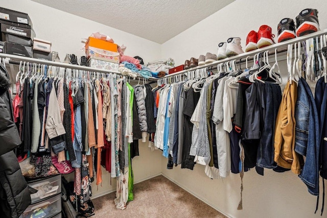 walk in closet featuring carpet