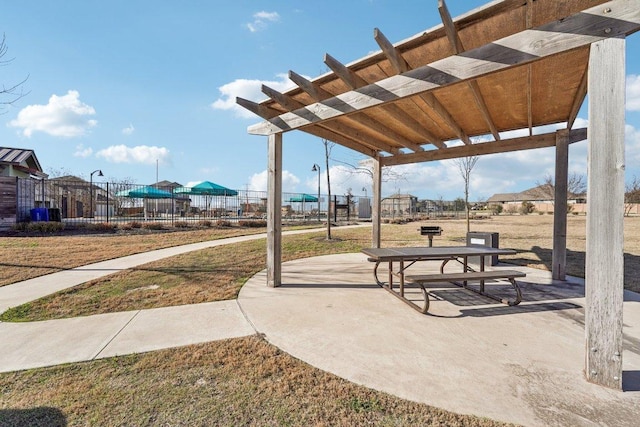 exterior space with fence and a pergola