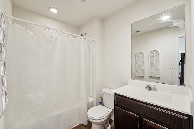 full bathroom with toilet, shower / bath combo, and vanity