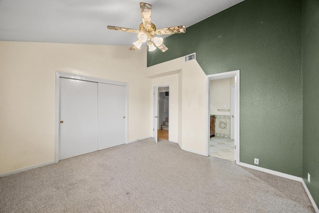 1100 Silverton Ct, Austin, TX 78753 - unfurnished bedroom featuring vaulted ceiling, a closet, carpet flooring, and baseboards