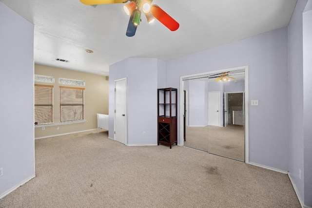 1100 Silverton Ct, Austin, TX 78753 - unfurnished bedroom with carpet, baseboards, a closet, and a ceiling fan