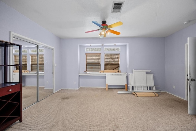 1100 Silverton Ct, Austin, TX 78753 - interior space featuring carpet floors, multiple windows, and baseboards