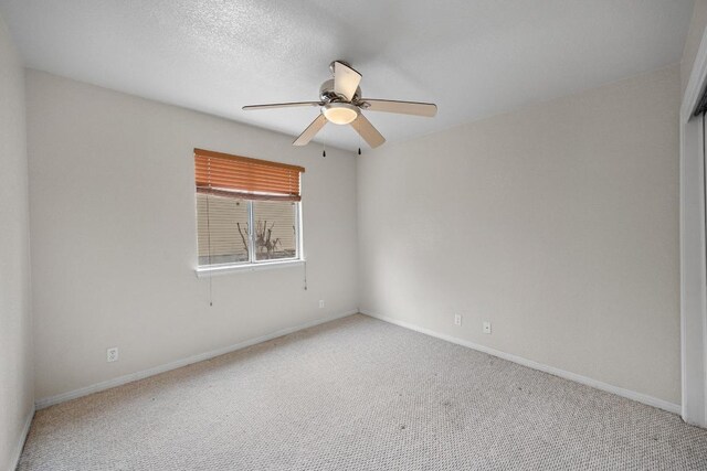 1100 Silverton Ct, Austin, TX 78753 - spare room featuring a ceiling fan, carpet flooring, and baseboards