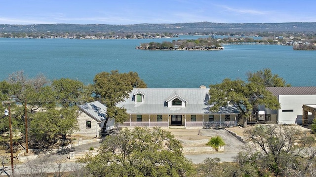 birds eye view of property featuring a water view