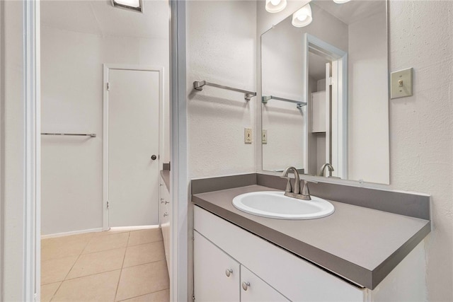 bathroom with vanity and tile patterned floors