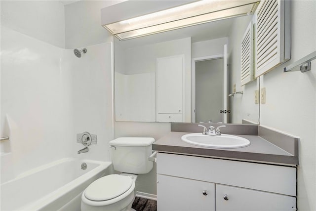 full bath featuring toilet, vanity, and shower / bathing tub combination