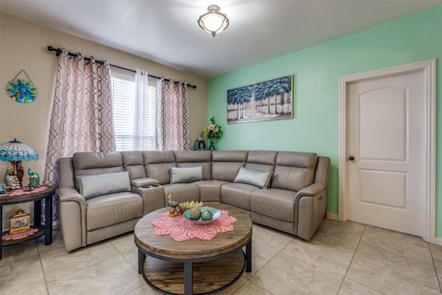 living area with light tile patterned floors and baseboards