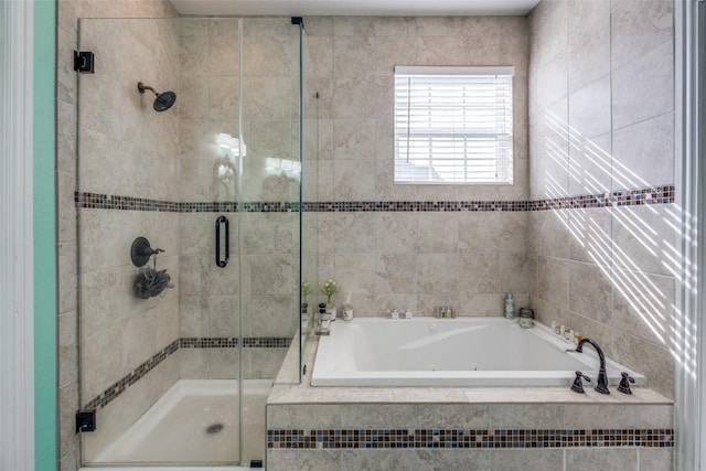 full bath featuring a shower stall and a jetted tub