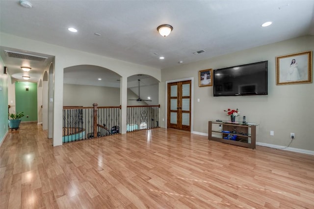 interior space with visible vents, baseboards, and light wood-style floors