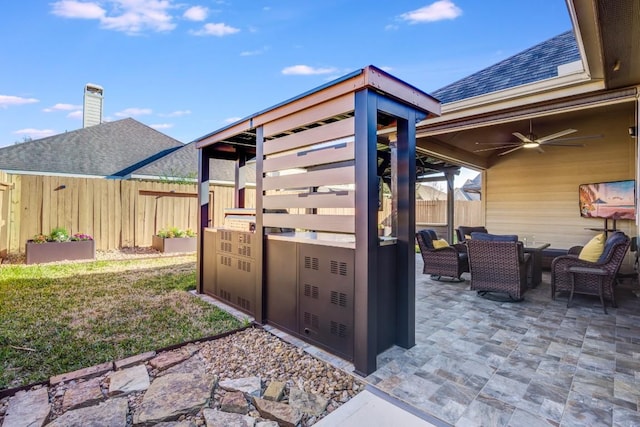 view of patio / terrace featuring outdoor dining space, a ceiling fan, and fence