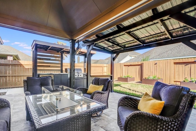 view of patio / terrace featuring area for grilling, outdoor dining area, a fenced backyard, and a grill