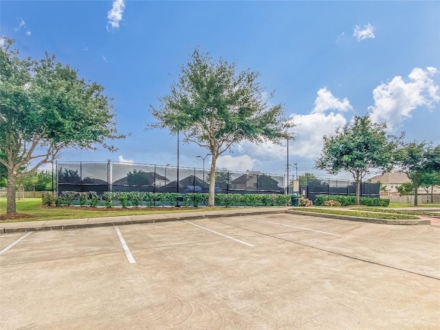 view of tennis court with fence