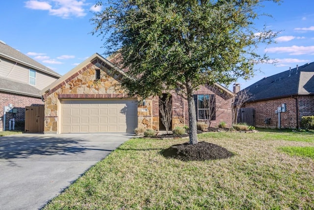 view of front of house featuring a front yard, an attached garage, stone siding, and driveway