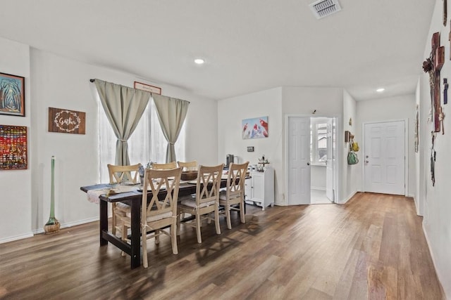 dining space with visible vents, recessed lighting, baseboards, and wood finished floors