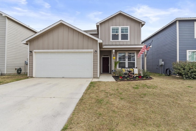 view of front of house with driveway, a front yard, board and batten siding, and an attached garage