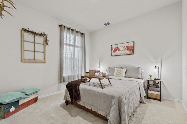 bedroom with carpet flooring, baseboards, and visible vents