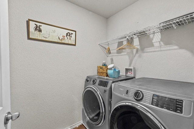 laundry area featuring laundry area and washing machine and clothes dryer