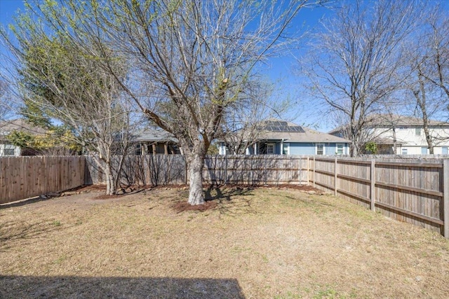 view of yard with a fenced backyard