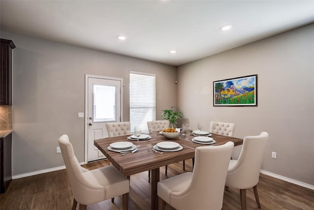 dining area with dark wood finished floors, recessed lighting, and baseboards