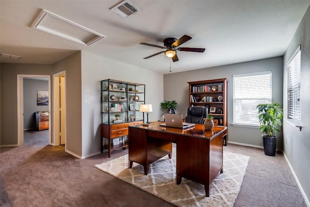 home office with attic access, baseboards, visible vents, and ceiling fan