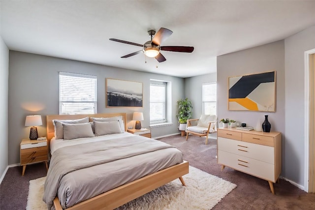 bedroom featuring baseboards, a ceiling fan, and dark carpet