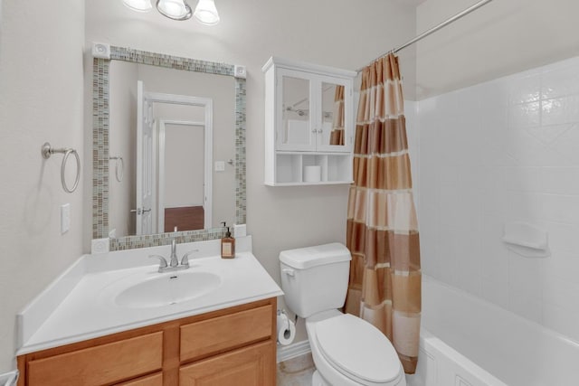 bathroom with toilet, vanity, and shower / bathtub combination with curtain